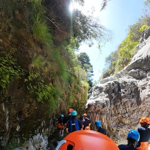 Group canyoning through a gorge
