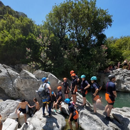 Group on rocks by the river